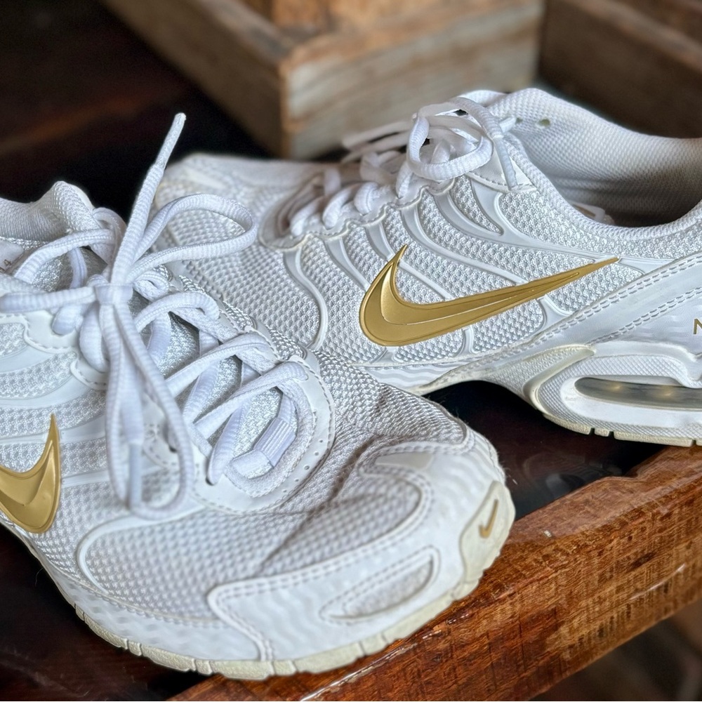 Nike Women's White Sneakers with Gold Accents